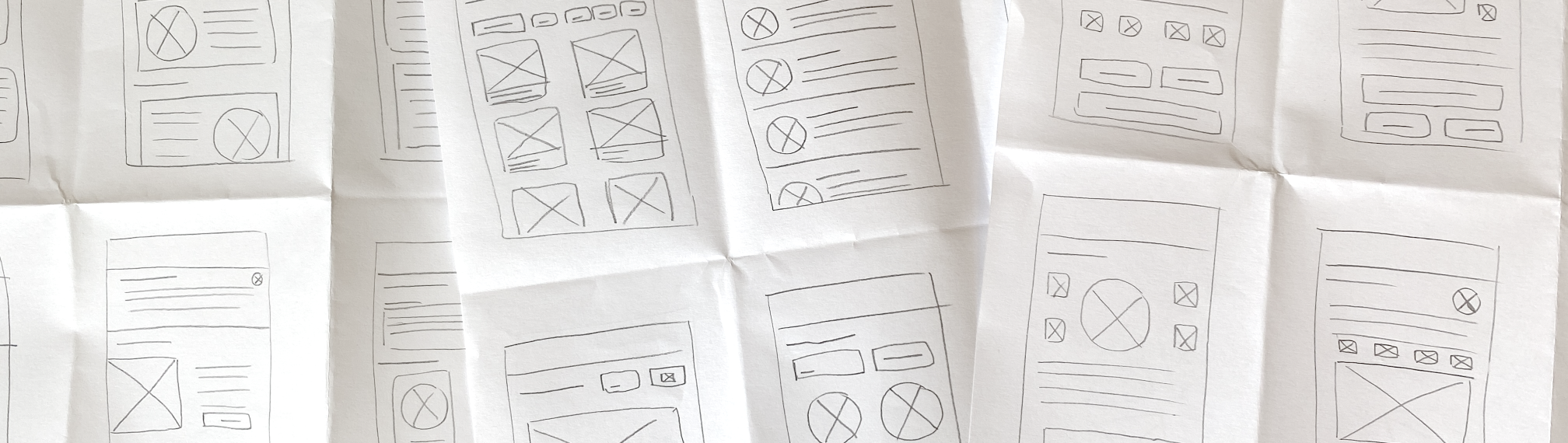 Paper with rough sketches of wireframes